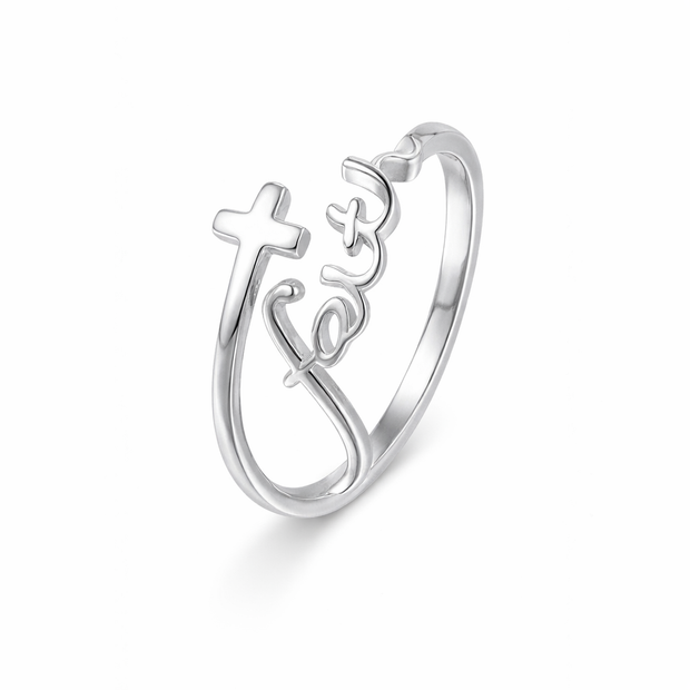 Silver ring with cross and 'Jesus' engraving on a white background