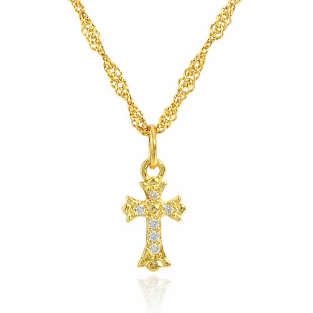Gold cross necklace with diamonds on a white background