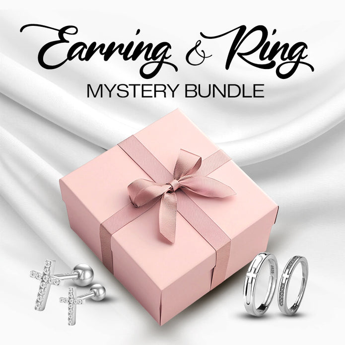 Pink gift box with a bow, earrings, and rings on a white background