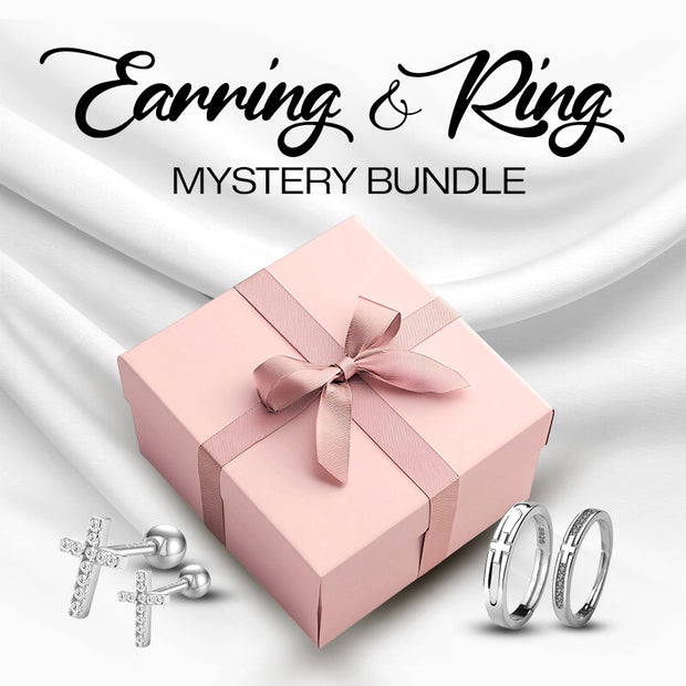 Pink gift box with a bow, earrings, and rings on a white background