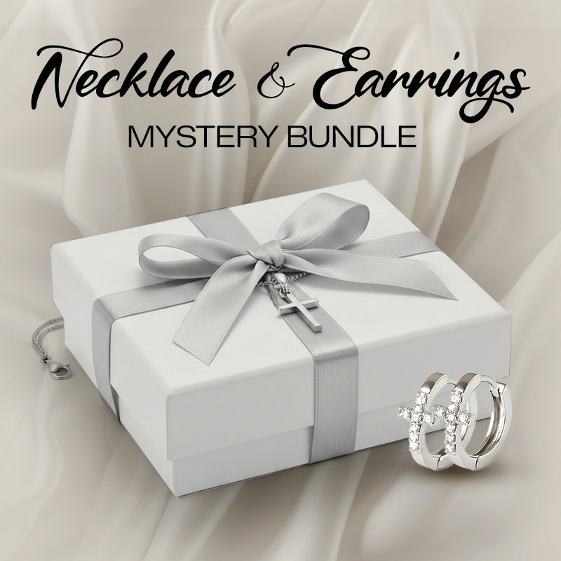 Jewelry set with necklace and earrings on a white box with silver ribbon, against a beige fabric background.